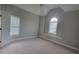Spacious, carpeted bedroom with vaulted ceiling and two windows providing ample natural light at 45 Mountain Crest Dr, Oxford, GA 30054
