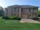Rear exterior of the home featuring brickwork, a patio, and windows at 45 Mountain Crest Dr, Oxford, GA 30054