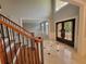 Elegant foyer with marble floors, custom iron doors, and a staircase with wood and iron railings at 45 Mountain Crest Dr, Oxford, GA 30054