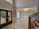 Spacious foyer featuring marble floors, custom iron doors, and an open view to the living spaces at 45 Mountain Crest Dr, Oxford, GA 30054