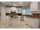 Well-appointed kitchen featuring white cabinets, tile backsplash, and stainless steel appliances at 45 Mountain Crest Dr, Oxford, GA 30054