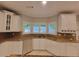 Bright kitchen with granite counters, stainless dishwasher, and windowed sink at 45 Mountain Crest Dr, Oxford, GA 30054