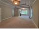 Spacious living room with a fireplace and trey ceilings and fan at 45 Mountain Crest Dr, Oxford, GA 30054