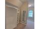 Custom walk-in closet with built-in shelving and a mirror, maximizing space and organization in the Primary suite at 45 Mountain Crest Dr, Oxford, GA 30054
