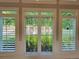 Elegant window with decorative glass inserts overlooking the landscaped backyard at 45 Mountain Crest Dr, Oxford, GA 30054