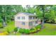 Spacious backyard featuring a two-story home with brick and vinyl siding and a large lawn at 5293 Sandy Shoals Ln, Stone Mountain, GA 30087