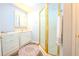 Bathroom with white cabinets, patterned flooring, and glass-enclosed shower at 5293 Sandy Shoals Ln, Stone Mountain, GA 30087