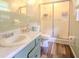Bathroom featuring a vanity with a sink, toilet, and walk-in shower with a glass door at 5293 Sandy Shoals Ln, Stone Mountain, GA 30087