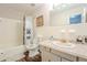 Well-lit bathroom with a shower-tub combination at 5293 Sandy Shoals Ln, Stone Mountain, GA 30087