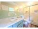 Bathroom featuring a vanity with a sink, toilet, and walk-in shower with a glass door at 5293 Sandy Shoals Ln, Stone Mountain, GA 30087