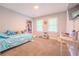 Cozy bedroom featuring plush carpet and two windows at 5293 Sandy Shoals Ln, Stone Mountain, GA 30087