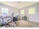 Bedroom with carpet and two windows at 5293 Sandy Shoals Ln, Stone Mountain, GA 30087