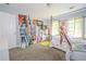 Bedroom featuring a four-poster bed, large anime standee, and neutral-toned carpet at 5293 Sandy Shoals Ln, Stone Mountain, GA 30087