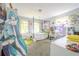Bedroom with a four poster bed, large anime standee, and study space with two monitors at 5293 Sandy Shoals Ln, Stone Mountain, GA 30087
