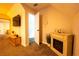 Bonus room featuring electric fireplace, TV, and open doorway at 5293 Sandy Shoals Ln, Stone Mountain, GA 30087