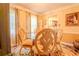Elegant dining room featuring a round glass table, ornate chairs, and decorative rug at 5293 Sandy Shoals Ln, Stone Mountain, GA 30087