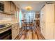 Bright kitchen featuring a dining area with a round table and modern appliances at 5293 Sandy Shoals Ln, Stone Mountain, GA 30087