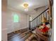 Bright foyer featuring an elegant chandelier and stained-glass front door at 5293 Sandy Shoals Ln, Stone Mountain, GA 30087