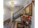 Charming foyer with a decorative table, area rugs, and staircase at 5293 Sandy Shoals Ln, Stone Mountain, GA 30087