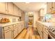 Bright kitchen featuring modern appliances, granite countertops, and light gray cabinetry at 5293 Sandy Shoals Ln, Stone Mountain, GA 30087