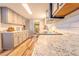 Bright kitchen featuring modern appliances, granite countertops, and light gray cabinetry at 5293 Sandy Shoals Ln, Stone Mountain, GA 30087