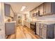 Spacious kitchen featuring modern appliances, granite countertops, and light gray cabinetry at 5293 Sandy Shoals Ln, Stone Mountain, GA 30087