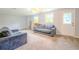 Spacious living room featuring neutral tones and comfortable seating at 5293 Sandy Shoals Ln, Stone Mountain, GA 30087