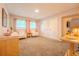 Inviting living room with plush carpet and two windows at 5293 Sandy Shoals Ln, Stone Mountain, GA 30087
