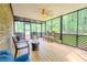 Spacious screened-in porch with wood floors and grill at 5293 Sandy Shoals Ln, Stone Mountain, GA 30087