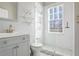 Stylish bathroom with modern fixtures, a glass-enclosed shower, and subway tile walls at 690 Piedmont Ne Ave # 17, Atlanta, GA 30308