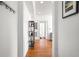 Bright hallway with hardwood floors, white walls, and stylish decor at 690 Piedmont Ne Ave # 17, Atlanta, GA 30308