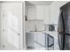 Well-lit kitchen featuring white cabinets, a subway tile backsplash, and modern appliances at 690 Piedmont Ne Ave # 17, Atlanta, GA 30308