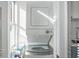 Compact laundry area featuring a stacked washer and dryer unit in a bright space at 690 Piedmont Ne Ave # 17, Atlanta, GA 30308