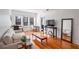 Bright living room featuring hardwood floors, large windows, and stylish furniture at 690 Piedmont Ne Ave # 17, Atlanta, GA 30308
