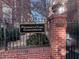 Piedmont & Third Condominium brick signage in landscaped common area at 690 Piedmont Ne Ave # 17, Atlanta, GA 30308