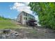Large backyard featuring a wooden deck, staircase, and lush landscaping, perfect for outdoor enjoyment at 765 Brooks Cir, Stone Mountain, GA 30087