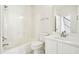 Bathroom with a tub and shower combo, white vanity, and a large mirror at 765 Brooks Cir, Stone Mountain, GA 30087