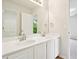 Bright bathroom with double sinks, white cabinets, and a large mirror at 765 Brooks Cir, Stone Mountain, GA 30087