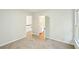 A neutrally decorated bedroom showing the door to the bathroom at 765 Brooks Cir, Stone Mountain, GA 30087