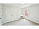 Well-lit bedroom featuring a built-in desk area and a large closet at 765 Brooks Cir, Stone Mountain, GA 30087