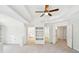 Spacious carpeted bedroom with tray ceilings, recessed lighting, and multiple entryways at 765 Brooks Cir, Stone Mountain, GA 30087