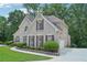 Stately brick home with lush landscaping, featuring a symmetrical design and attached garage at 765 Brooks Cir, Stone Mountain, GA 30087