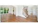 Spacious foyer featuring hardwood flooring, large window, and a staircase with hardwood railing at 765 Brooks Cir, Stone Mountain, GA 30087