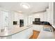 Kitchen featuring white cabinets, stainless steel appliances, large island, and hardwood flooring at 765 Brooks Cir, Stone Mountain, GA 30087