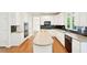 Modern kitchen with white cabinets, stainless steel appliances, and a large island for meal prep at 765 Brooks Cir, Stone Mountain, GA 30087