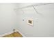 Functional laundry area with electric hookups and storage shelves at 765 Brooks Cir, Stone Mountain, GA 30087