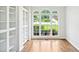 Hardwood floor and large windows in office with built in shelving at 765 Brooks Cir, Stone Mountain, GA 30087