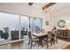 Light-filled dining room with sliding glass doors to the outdoor patio area at 114 Village Green Ave, Woodstock, GA 30189