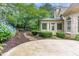 Professionally landscaped backyard with stone pathway leading to the sunroom at 3905 Merriweather Woods, Johns Creek, GA 30022