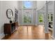 Grand foyer with high ceilings, hardwood floors, and an elegant doorway at 3905 Merriweather Woods, Johns Creek, GA 30022